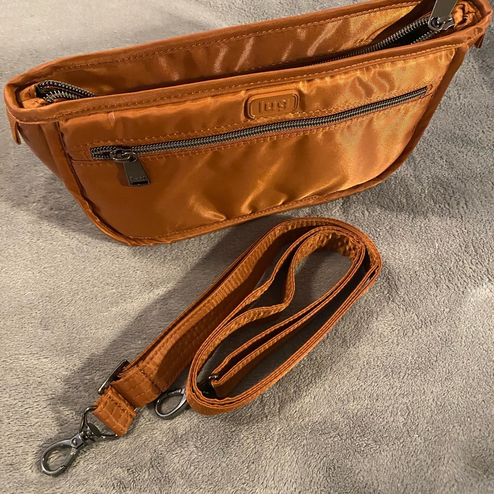 lug Parasail Copper NWOT w/matching 1.25 strap. Makes a great little crossbody